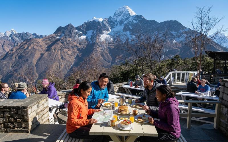 Everest helicopter tour group at breakfast, Hotel Everest View terrace