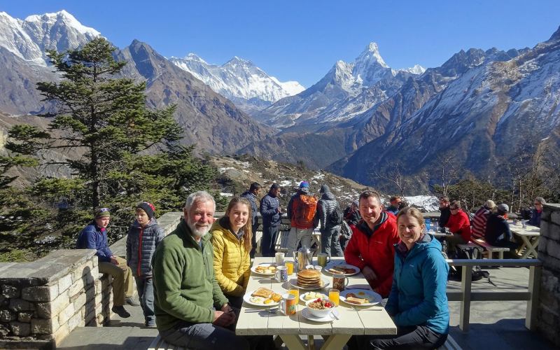 Guest having breakfast during Lukla to Hotel Everest View (HEV) Helicopter Flight